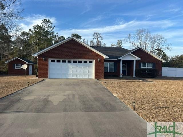 ranch-style house featuring a garage