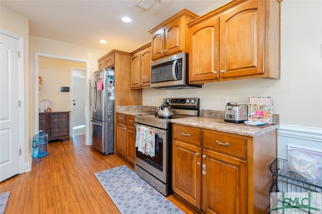 164 Glynn Ct, Hinesville, GA 31313 - kitchen with appliances with stainless steel finishes and light wood-type flooring