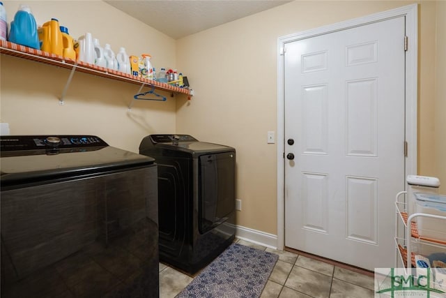 164 Glynn Ct, Hinesville, GA 31313 - laundry area with washer and dryer and light tile patterned floors