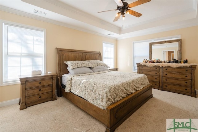 164 Glynn Ct, Hinesville, GA 31313 - carpeted bedroom featuring a raised ceiling, ornamental molding, ceiling fan, and multiple windows