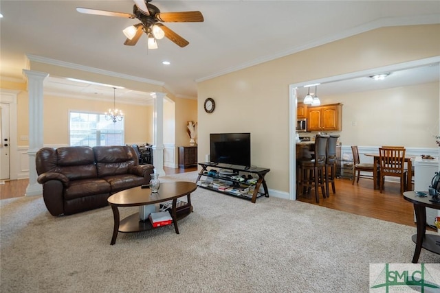 164 Glynn Ct, Hinesville, GA 31313 - carpeted living room with crown molding, ceiling fan with notable chandelier, and decorative columns