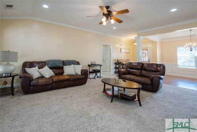 164 Glynn Ct, Hinesville, GA 31313 - living room featuring ceiling fan with notable chandelier, ornamental molding, carpet flooring, and decorative columns