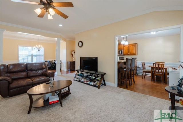 164 Glynn Ct, Hinesville, GA 31313 - carpeted living room featuring decorative columns, ornamental molding, and ceiling fan with notable chandelier