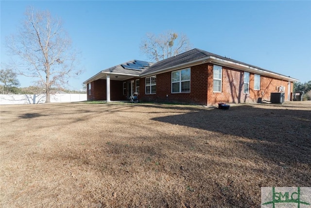 164 Glynn Ct, Hinesville, GA 31313 - view of front facade featuring central AC and solar panels