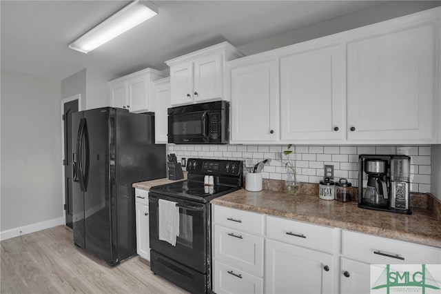 kitchen with white cabinetry, backsplash, light hardwood / wood-style flooring, and black appliances