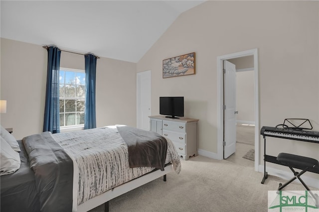 bedroom with light carpet and vaulted ceiling