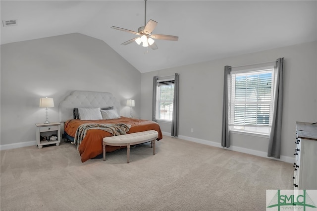 carpeted bedroom featuring ceiling fan and vaulted ceiling