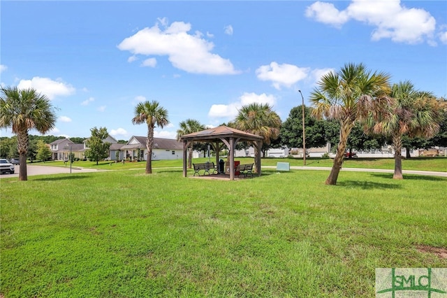 view of home's community with a gazebo and a yard