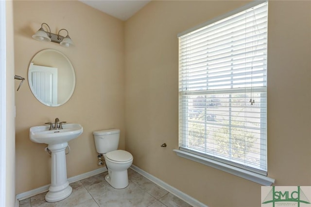 bathroom featuring tile patterned floors and toilet