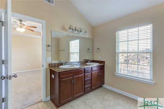 bathroom featuring tile patterned floors, ceiling fan, lofted ceiling, and vanity