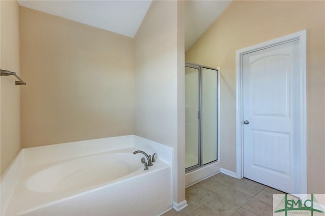 bathroom featuring tile patterned floors and plus walk in shower