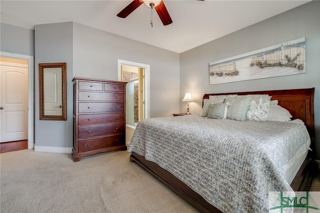 bedroom featuring light colored carpet and ceiling fan