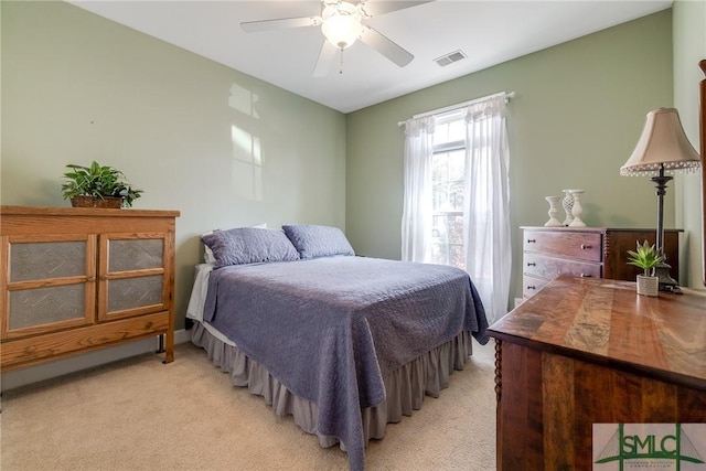 bedroom featuring ceiling fan and light carpet