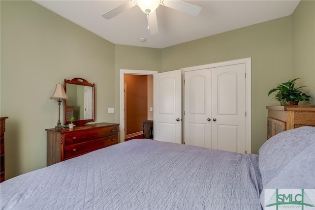 bedroom with ceiling fan and a closet