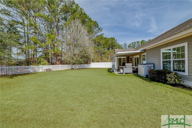 view of yard with a fenced backyard