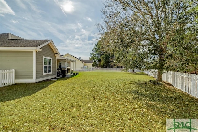 view of yard with a fenced backyard