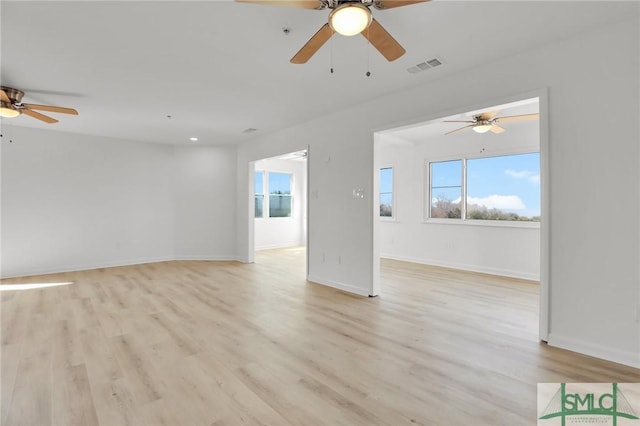46 Captains Vw, Tybee Island, GA 31328 - unfurnished living room featuring ceiling fan, plenty of natural light, and light wood-style flooring