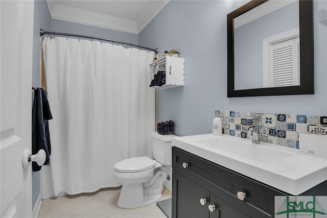 bathroom with tile patterned flooring, crown molding, vanity, and toilet