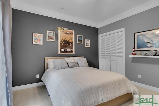 carpeted bedroom featuring ornamental molding and a closet