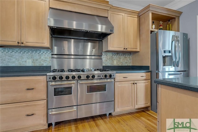 kitchen with tasteful backsplash, light brown cabinets, stainless steel appliances, range hood, and light hardwood / wood-style floors