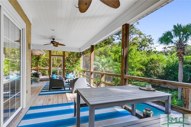 sunroom featuring wooden ceiling and ceiling fan