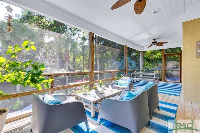 sunroom featuring wooden ceiling and ceiling fan