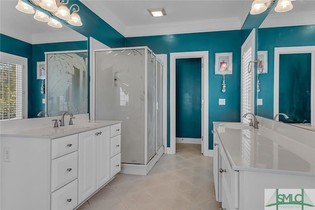 bathroom with vanity, a shower with door, and ornamental molding