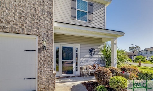 view of exterior entry with a garage