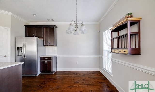 kitchen with hanging light fixtures, stainless steel refrigerator with ice dispenser, ornamental molding, and dark wood-type flooring