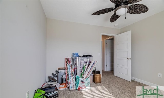 interior space with light colored carpet and ceiling fan