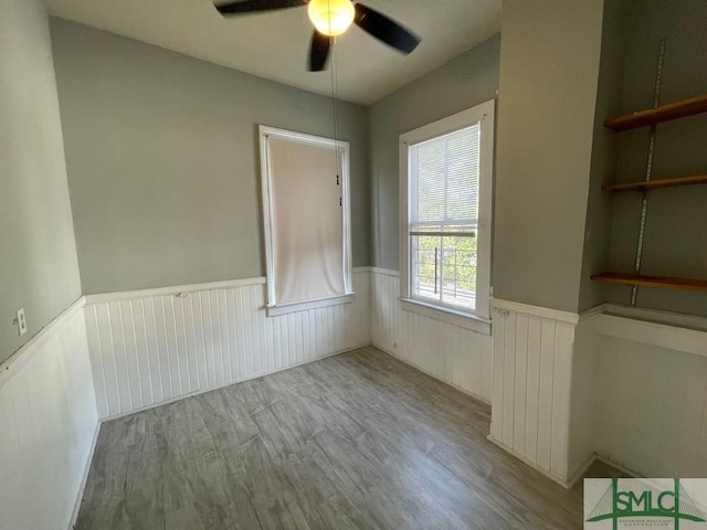 spare room featuring ceiling fan and light wood-type flooring