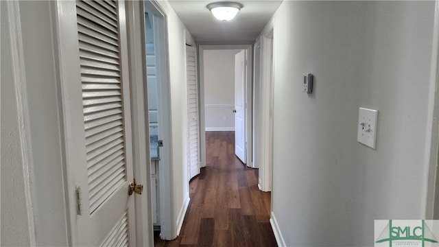 corridor featuring dark hardwood / wood-style floors