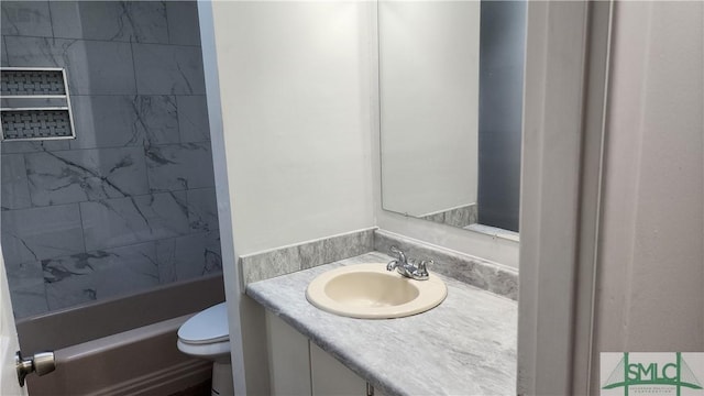 bathroom featuring vanity and toilet