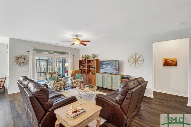 living room featuring dark hardwood / wood-style flooring and ceiling fan