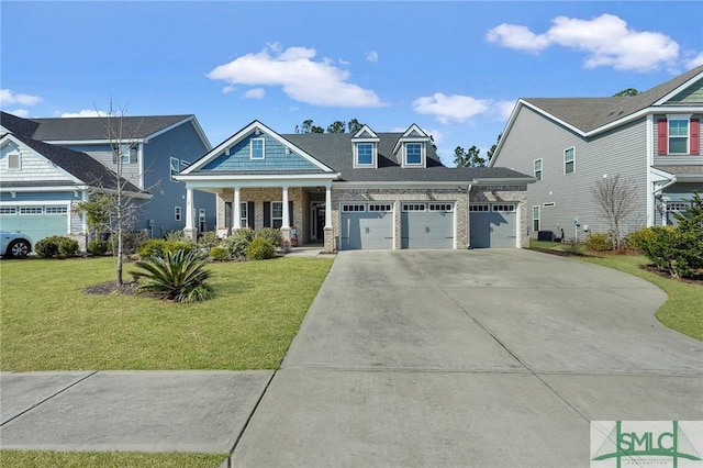 view of front of home with a garage, a porch, and a front lawn