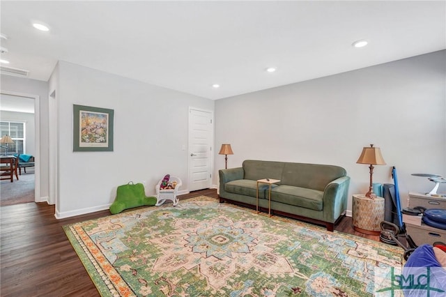 living room with dark hardwood / wood-style flooring