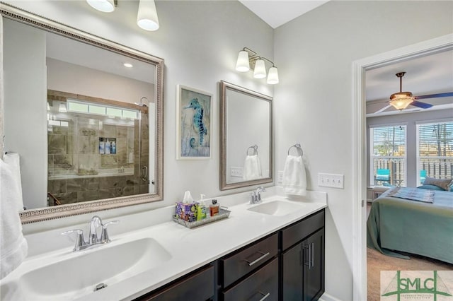 bathroom featuring ceiling fan, vanity, and tiled shower