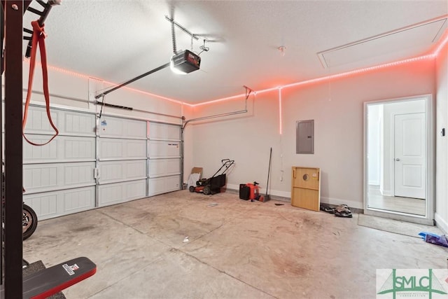 garage with a garage door opener and electric panel