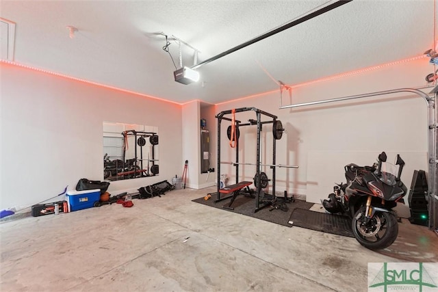 workout room with water heater and a textured ceiling