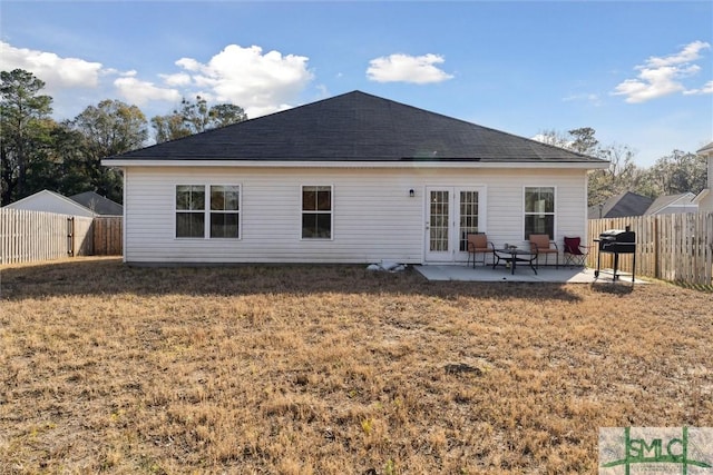 back of house featuring a yard and a patio