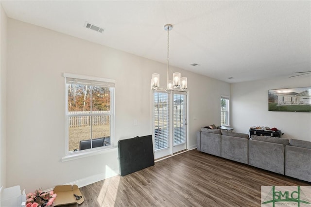 living room featuring hardwood / wood-style floors and a chandelier