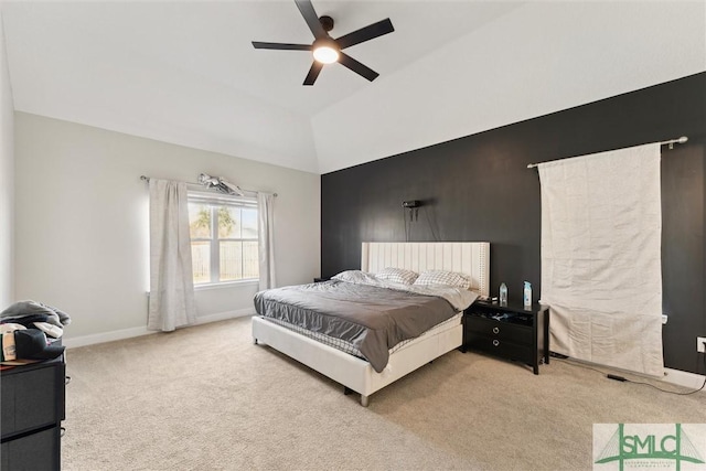 carpeted bedroom with vaulted ceiling and ceiling fan