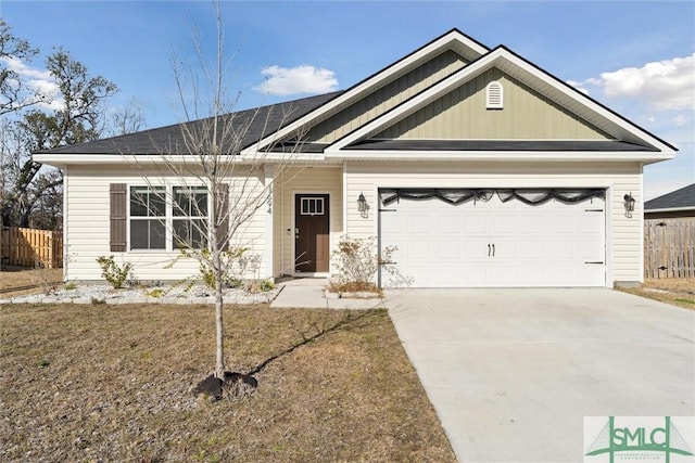 view of front facade featuring a garage and a front lawn