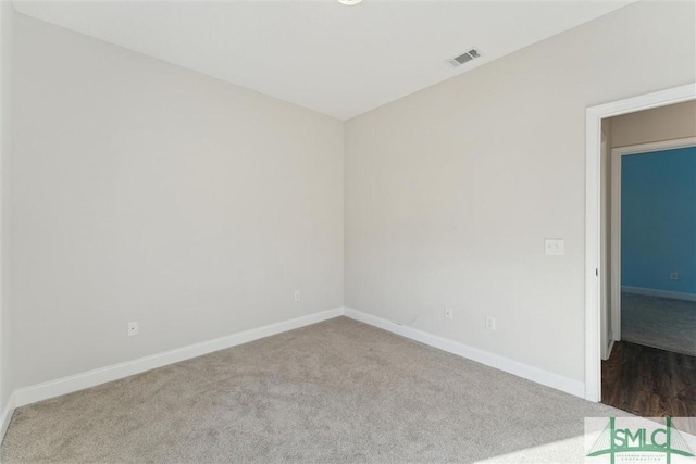 empty room with carpet flooring