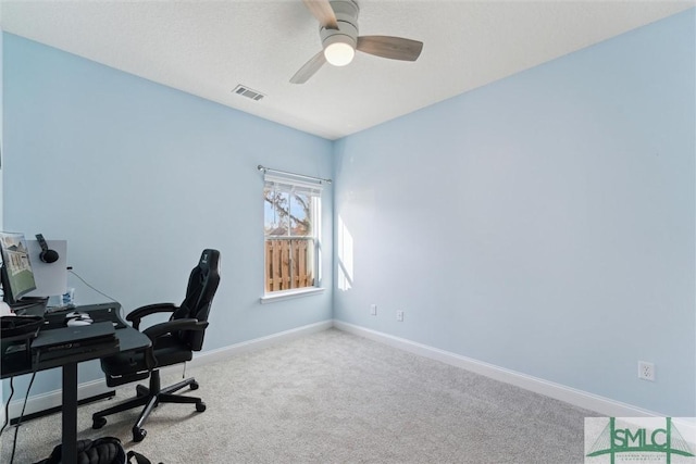 office featuring carpet floors and ceiling fan