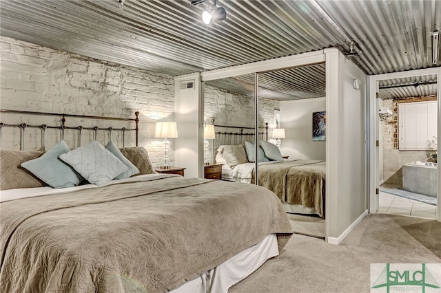 carpeted bedroom with a closet