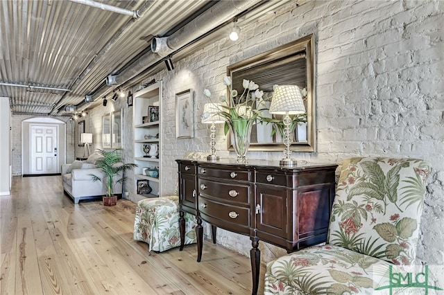 sitting room featuring light wood-type flooring