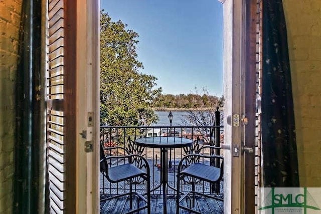 balcony featuring a water view