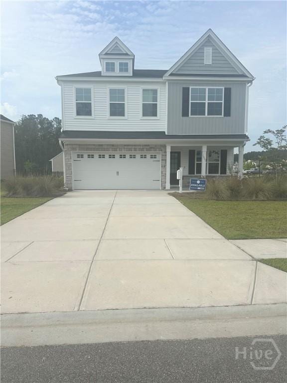 1001 Easthaven Blvd, Pooler, GA 31322 - view of front of property with covered porch, driveway, an attached garage, and a front yard