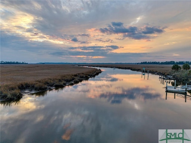 property view of water featuring a boat dock